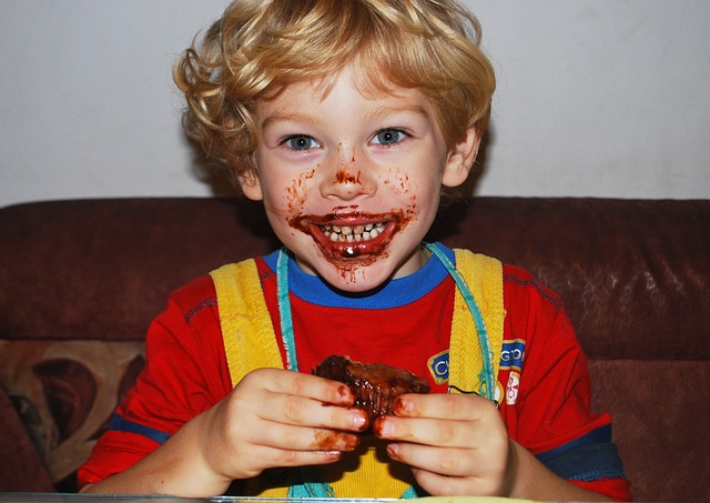 boy-eating-chocolate-muffin
